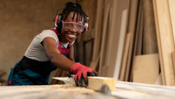 carpenter-cutting-mdf-board-inside-workshop_23-2149451048